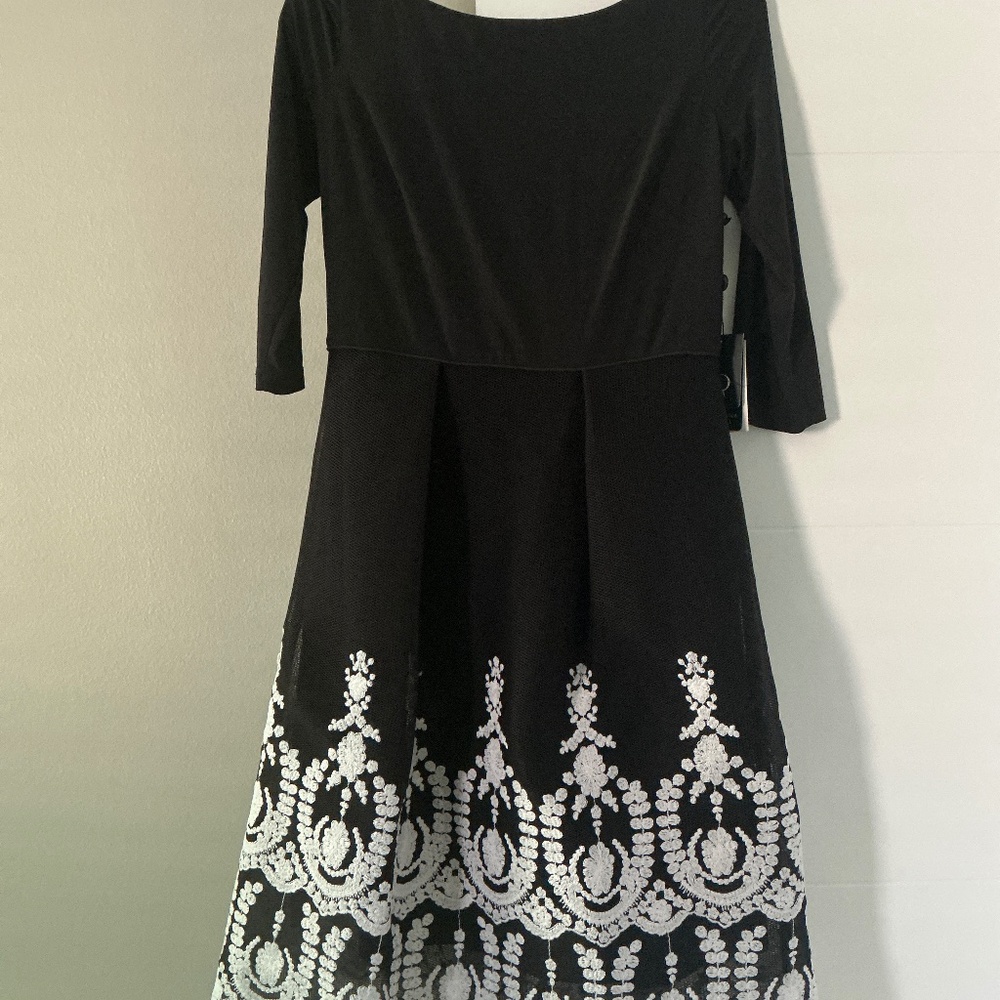 Beautiful dress, size 8, new with tags.